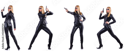 Woman in leather costume with gun isolated on white