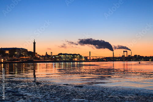 Winter sunset on the frozen sea in Gothenburg Sween photo