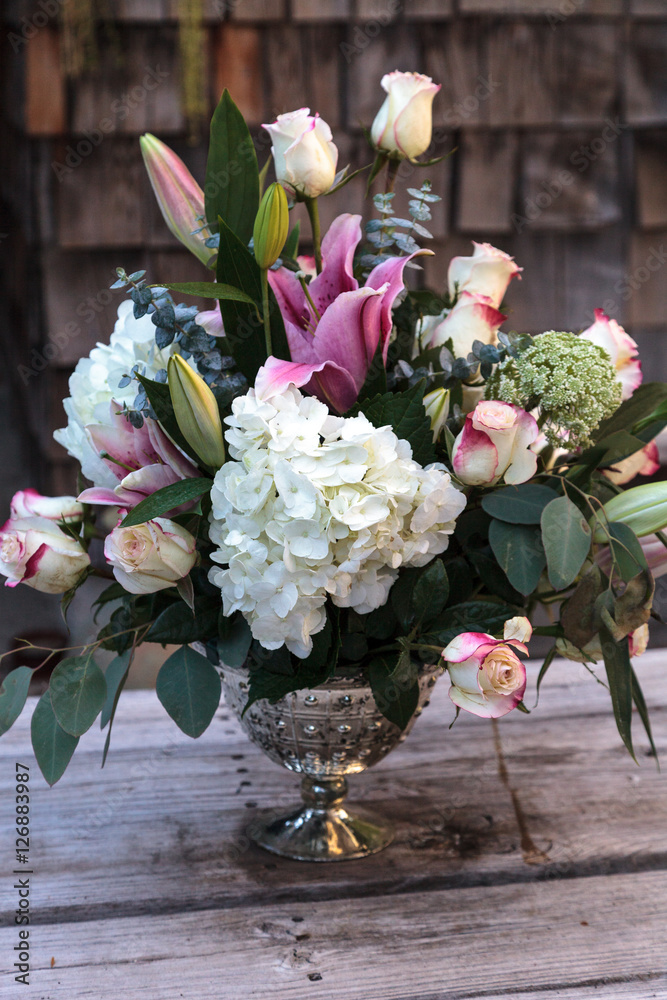 Wedding bouquet of white and pink flowers including roses, hydrangea, star  gazer lilies and queen annes lace on a rustic table in the French  countryside on Valentine's Day Stock Photo | Adobe