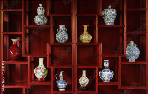 Ancient chinese vases in a traditional cupboard