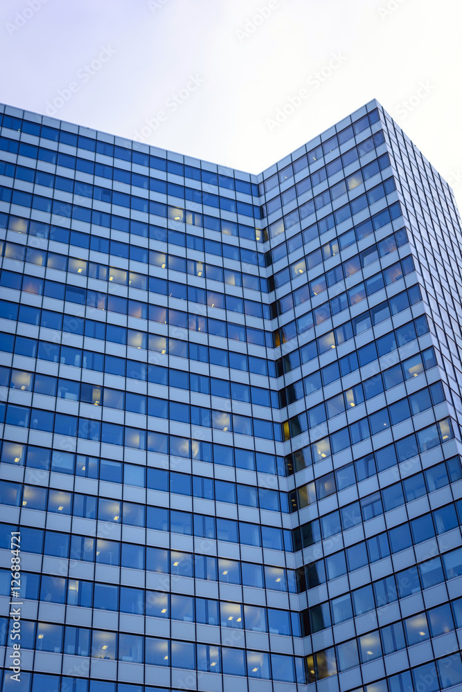 a nice tall office building with the sky in the background