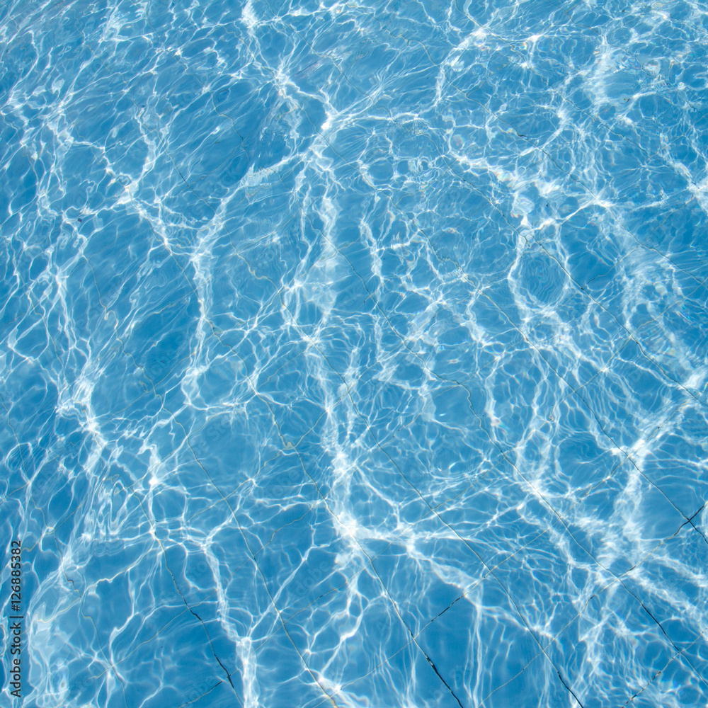 Surface of swimming pool water background