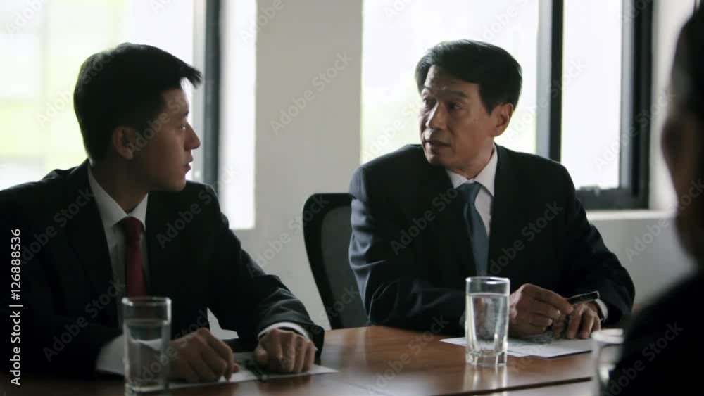 MS SELECTIVE FOCUS Businessmen and woman talking at meeting / China MS SELECTIVE FOCUS Businessmen and woman talking at meeting / China