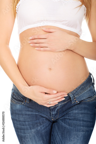 Pregnant woman showing her belly © Piotr Marcinski