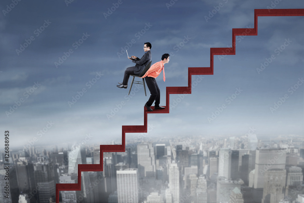 Businessman and his colleague with red stair Businessman and his colleague with red stair