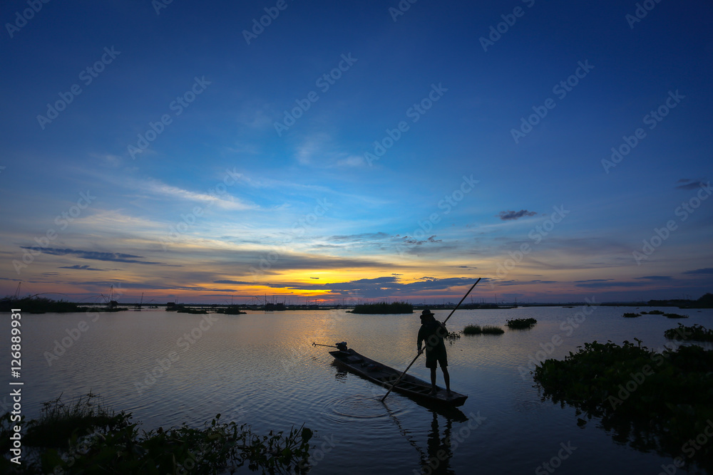 Fishermen in Inle lakes sunset, Myanmar. Fishermen is finish a day of fishing in Inle lake, Myanmar (Burma). Inle is one of the most favorite tourist places in Myanmar (Burma)