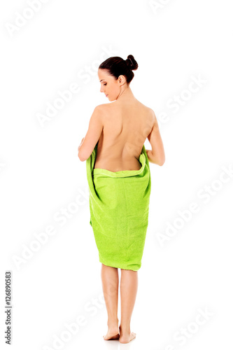 Young beautiful woman after bath full portrait isolated over white.