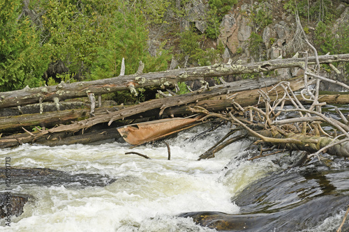 Broken Canoe in a Waterfall