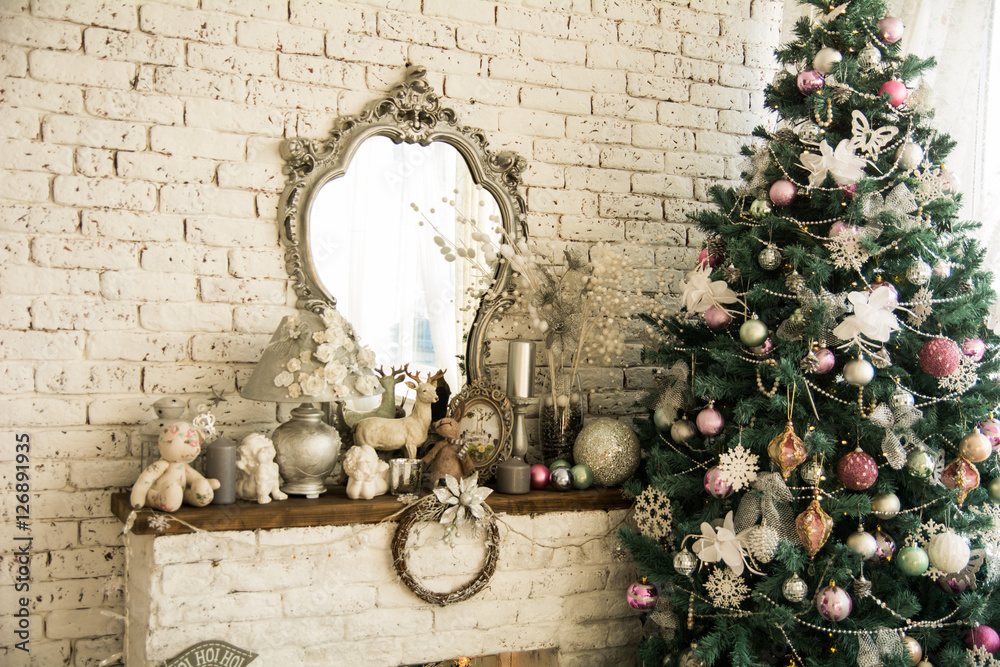 Background brick wall with a mirror Christmas spruce