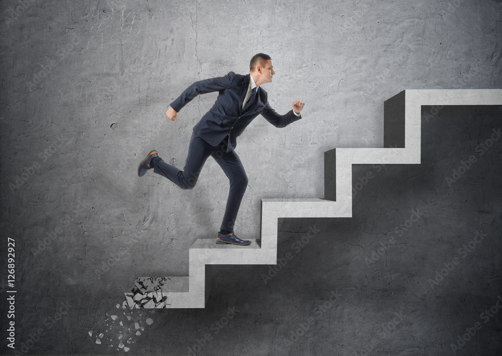 Businessman running up concrete staircase, which is crushing down after him Businessman running up concrete staircase, which is crushing down after him