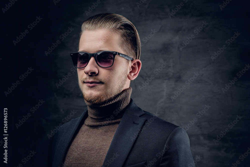 Obraz premium A man in sunglasses in turtle-neck sweate.