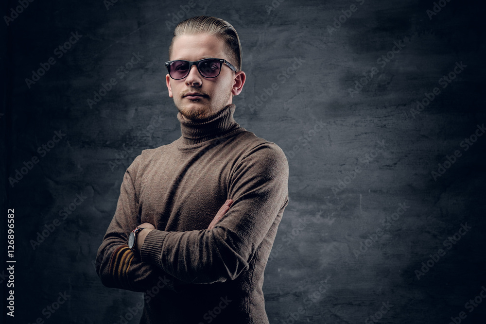 Fototapeta premium A man in sunglasses in turtle-neck sweate.