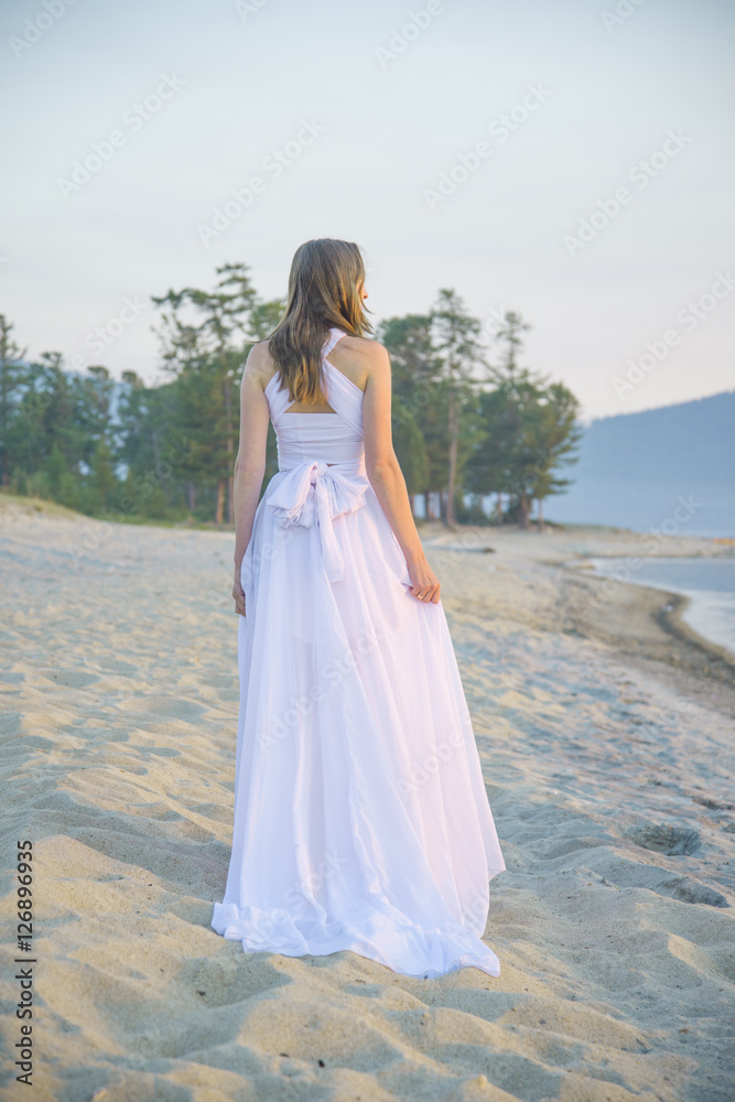 Beautiful girl walking on the beach. Beautiful girl walking on the beach.