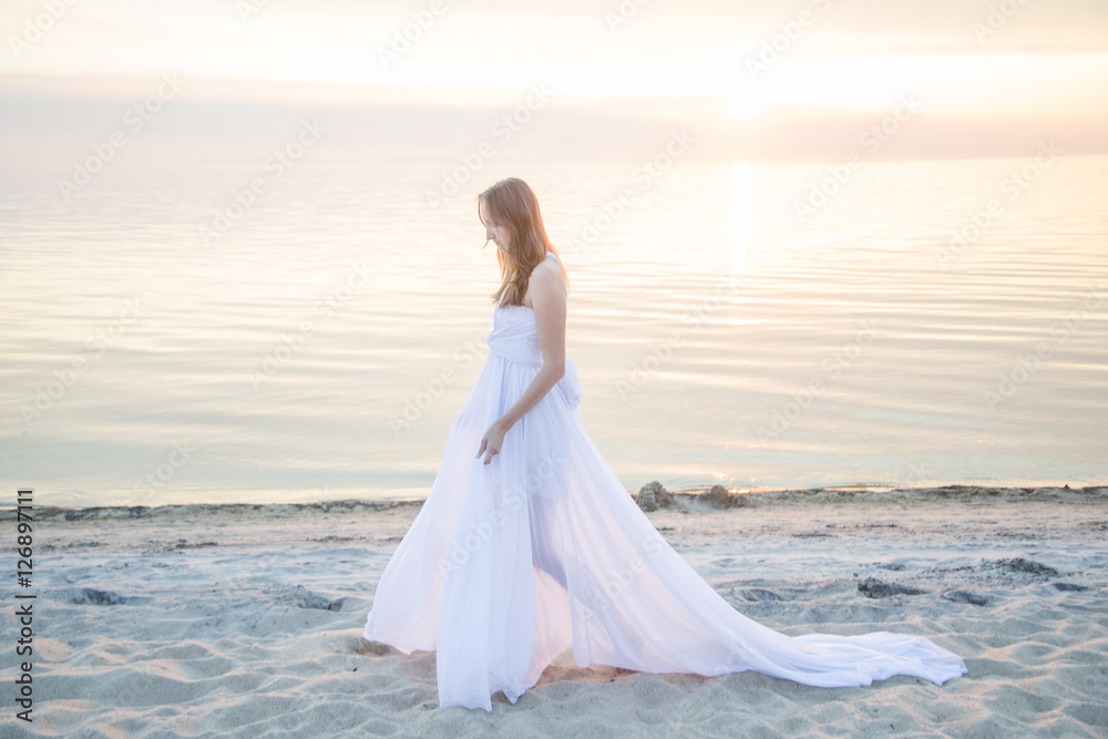 Beautiful girl walking on the beach. Beautiful girl walking on the beach.