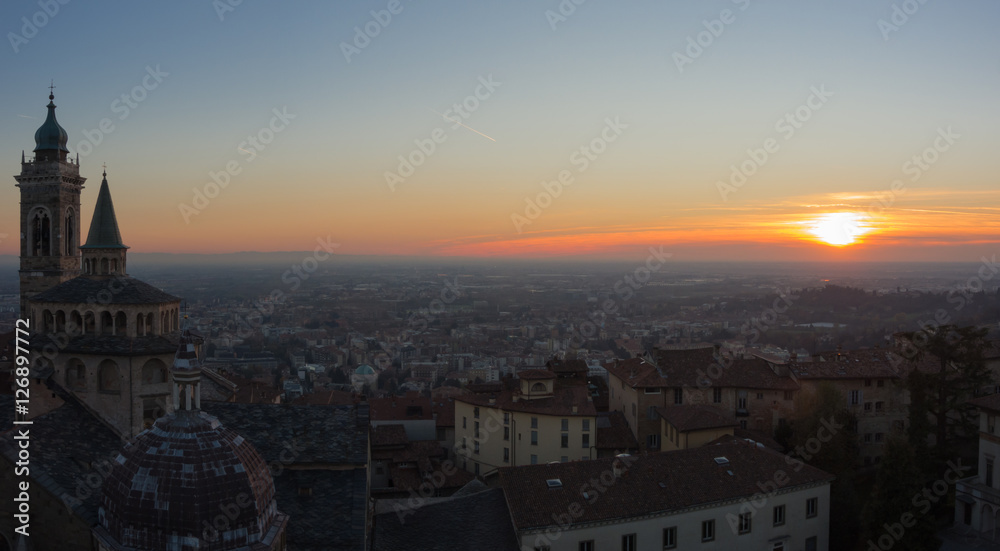 Bergamo - Old city (Citta Alta). One of the beautiful city in Italy. Lombardia. Evening sunset. Landscape on the old city, Cathedral, clock towers and the Po Valley.