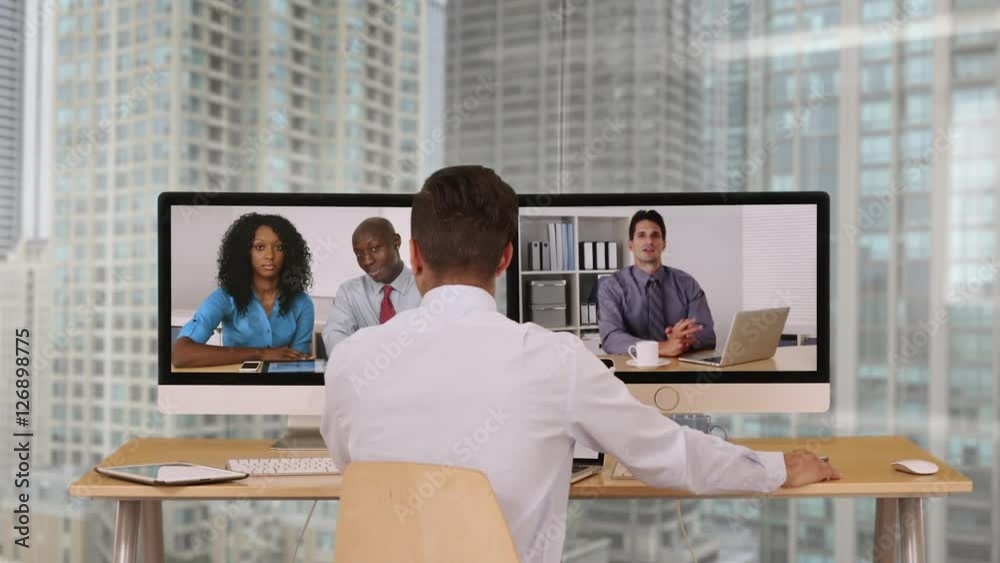 Successful group of business associates having internet based web conference over video chat. Black, Hispanic and Caucasian team of office workers communicate using modern technology Successful group of business associates having internet based web conference over video chat. Black, Hispanic and Caucasian team of office workers communicate using modern technology