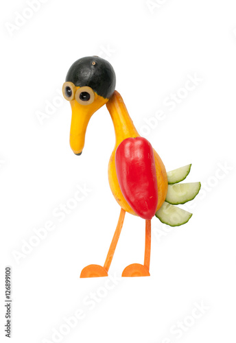 Sad bird made of vegetables on white background