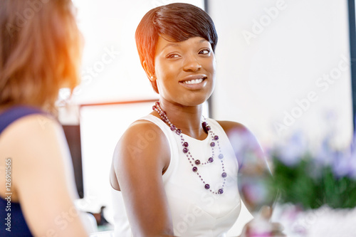 Women working together, office interior