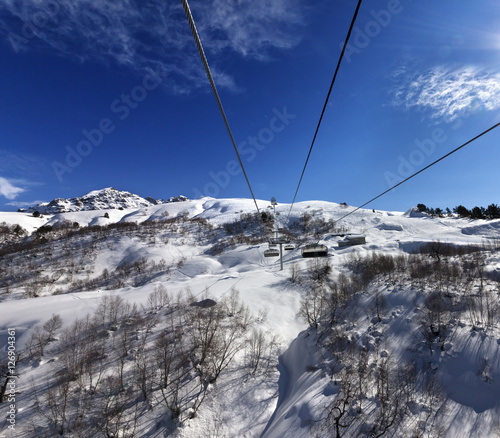 Chair-lift at ski resort in sun winter day © BSANI