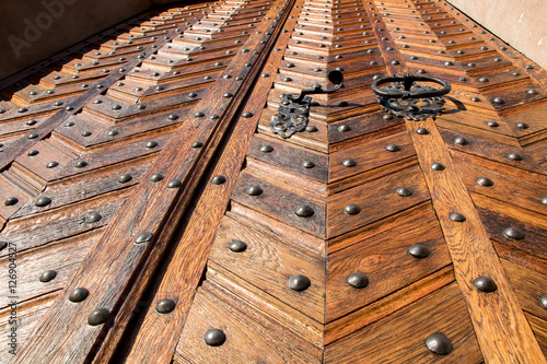 Old wooden door from view below © milkovasa