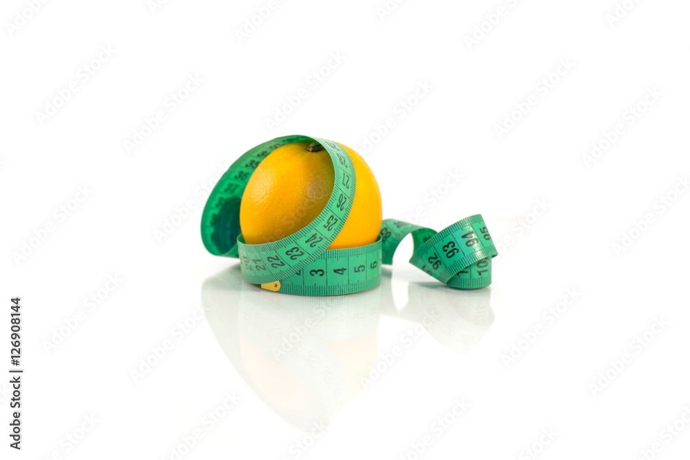 Orange and measuring tape on a white background. Stock-Foto | Adobe Stock