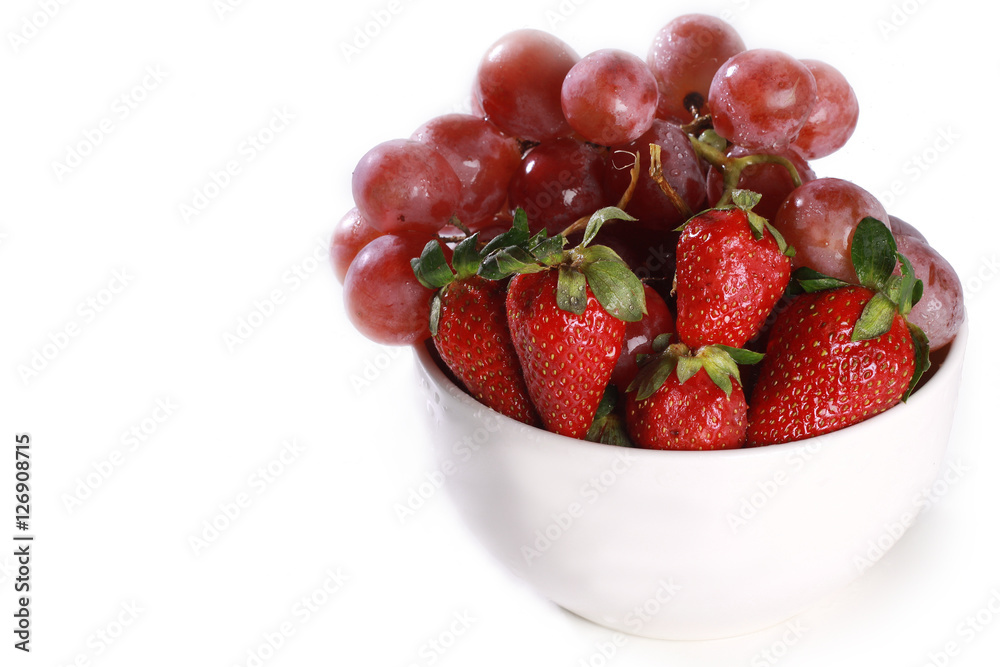 a bowl with strawberry and grapes a bowl with strawberry and grapes