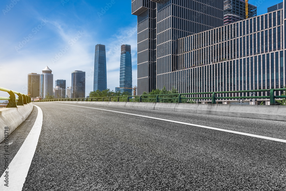 empty asphalt road through modern city in China.