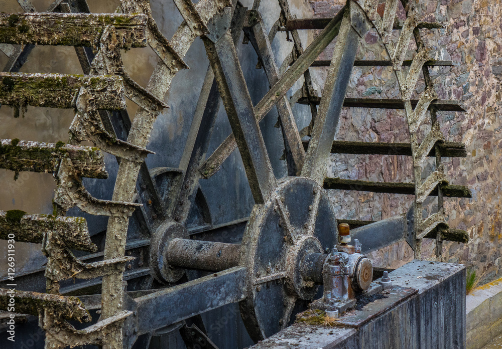 The old and wooden whell of watermill in sunshine The old and wooden whell of watermill in sunshine