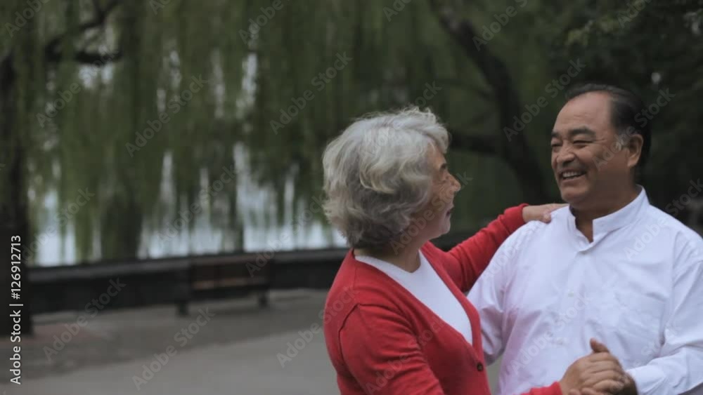 MS Elderly couple dancing together in park/ Beijing, China MS Elderly couple dancing together in park/ Beijing, China