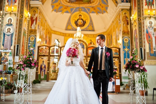 Stylish  wedding couple at church © AS Photo Family