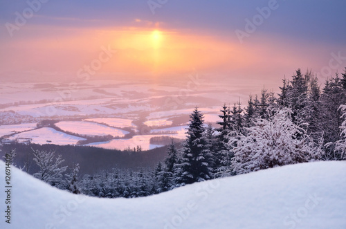 Wonderful winter sunset over the valley