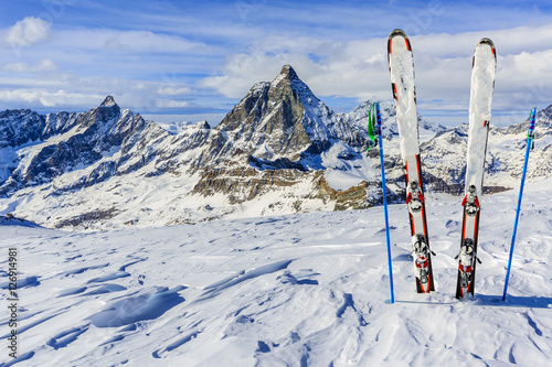 Fototapeta Ski Equipment with panoramic view of Matterhorn on a clear sunny