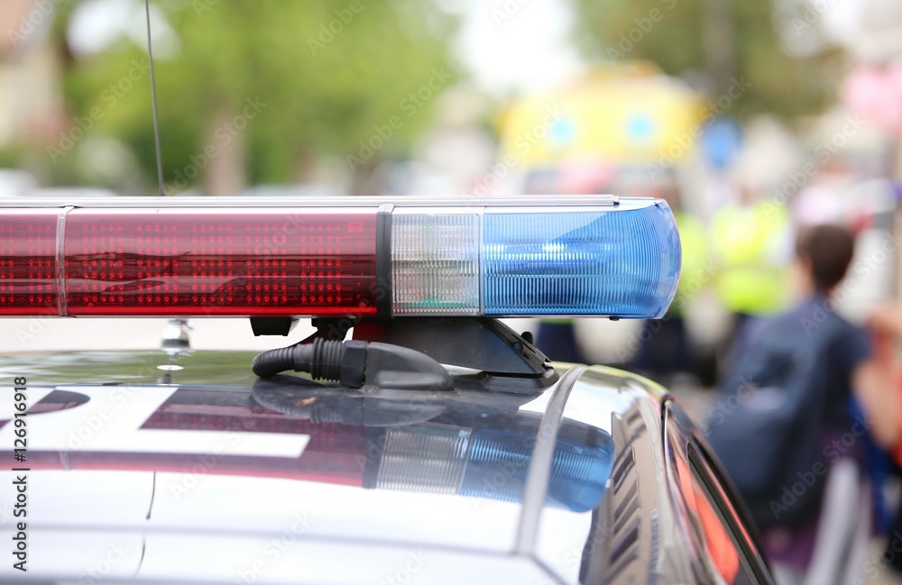 red and blue flashing lights of police patrol during an uprising Stock