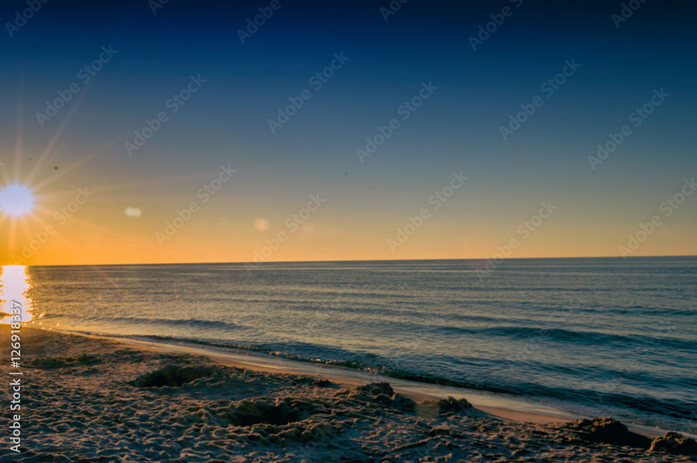Obraz premium Zachód słońca nad morzem bałtyckim
