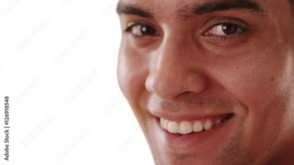 Close up of smiling millennial Hispanic man on white background with copy space. Happy Mexican guy looking at camera with copyspace Close up of smiling millennial Hispanic man on white background with copy space. Happy Mexican guy looking at camera with copyspace