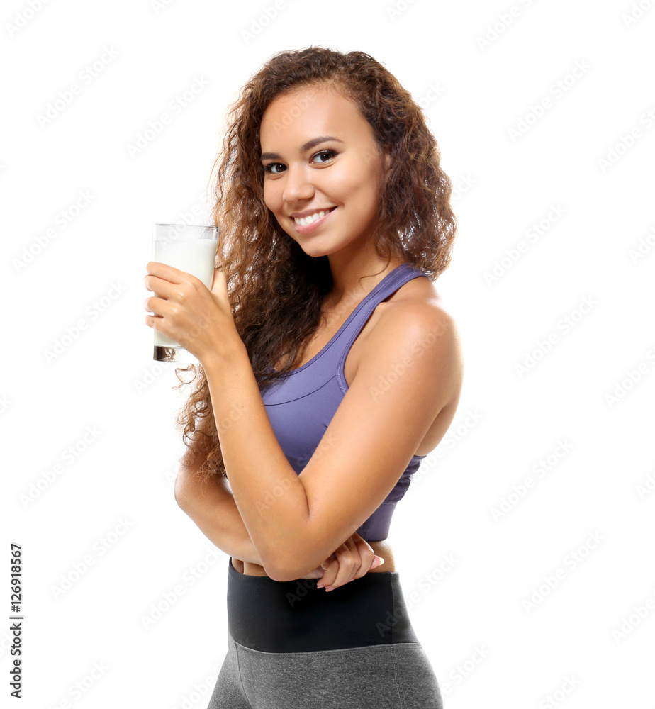 Attractive young African woman with glass of milk on white background Attractive young African woman with glass of milk on white background