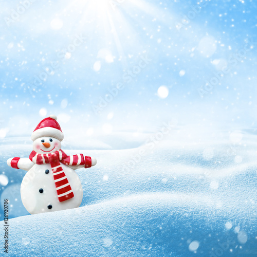 Winter background. Festive template for congratulations with cheerful snowman.