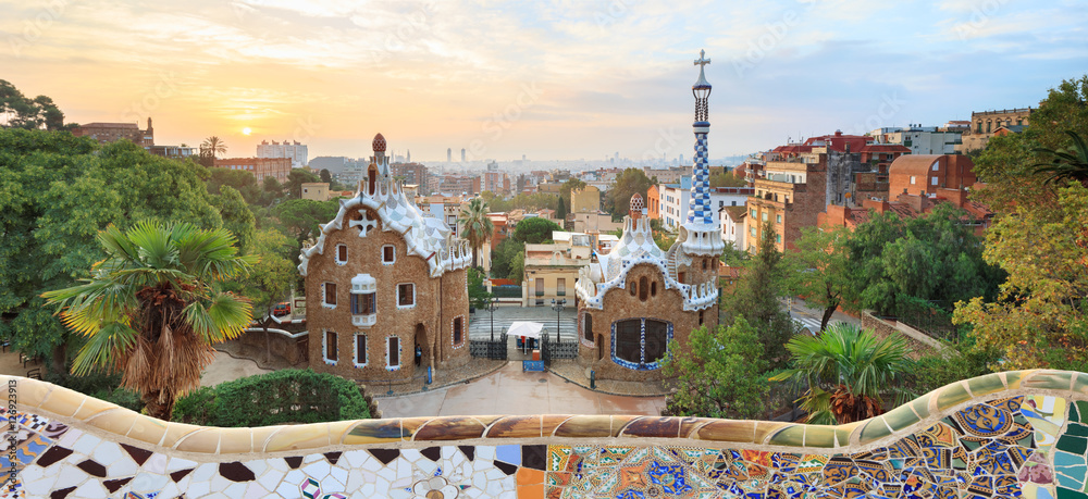 Park Guell in Barcelona. View to entrace houses with mosaics on foreground