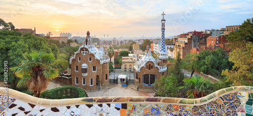 Park Guell in Barcelona. View to entrace houses with mosaics on foreground photo