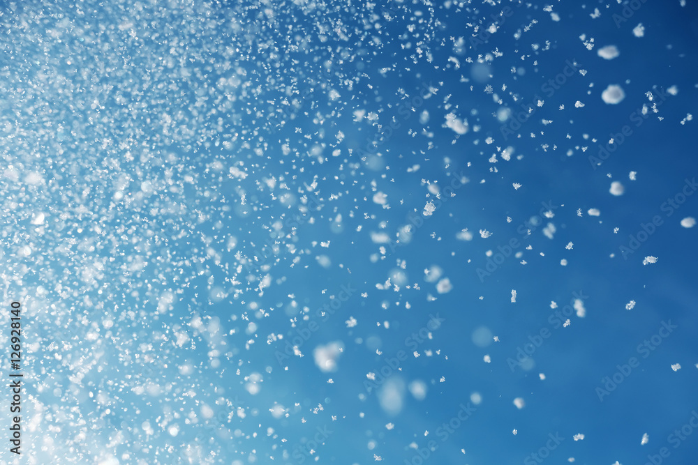 falling snow on blue sky falling snow on blue sky
