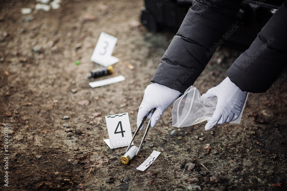 Crime scene investigation - collecting evidence . Stock Photo | Adobe Stock