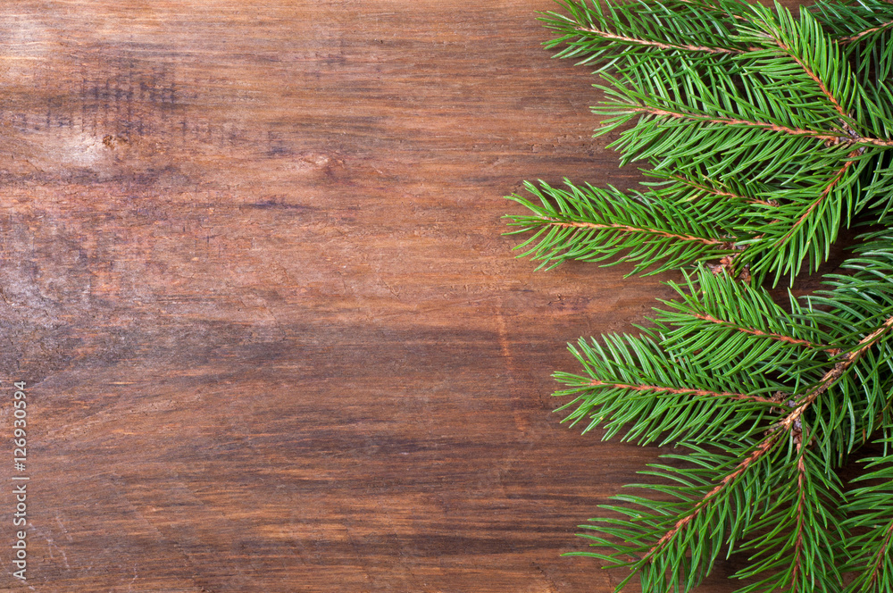 Christmas background. Christmas tree on old wooden board. Top view Christmas background. Christmas tree on old wooden board. Top view