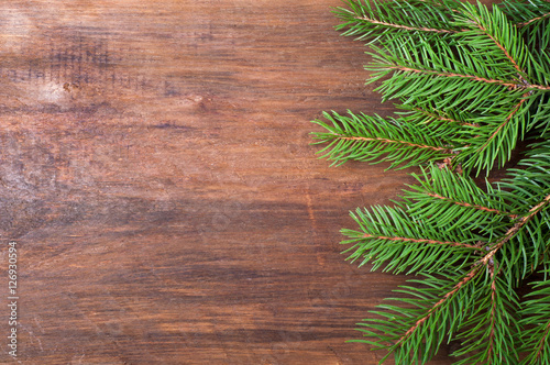 Christmas background. Christmas tree on old wooden board. Top view