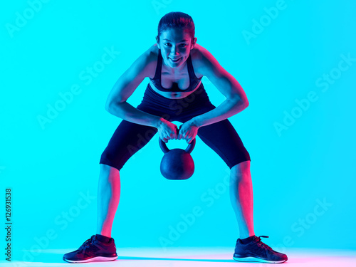woman fitness Kettle Bell exercices isolated
