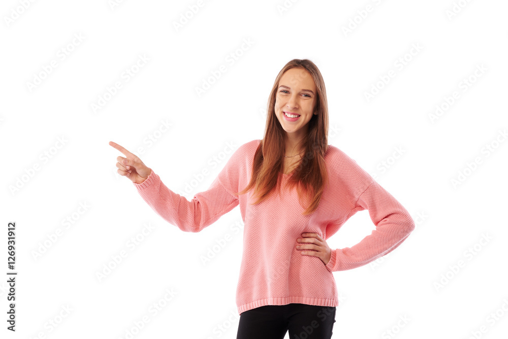 Happy teen girl pointing with index finger at someone or somethi Happy teen girl pointing with index finger at someone or somethi
