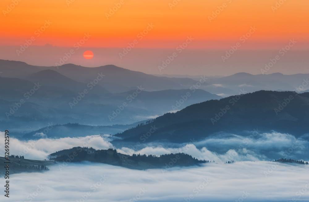 Ukraine. Carpathians. Morning fog in the valley village Dzembronya