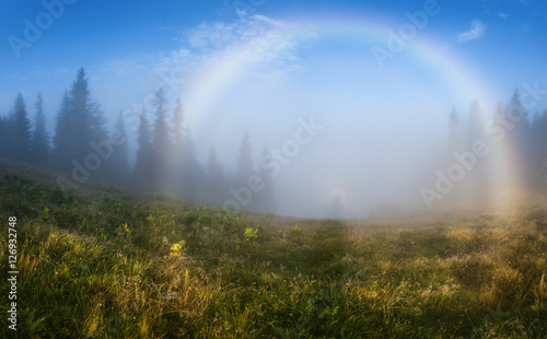 Ukraine. Carpathians. Brocken Spectre with a rainbow in the mist