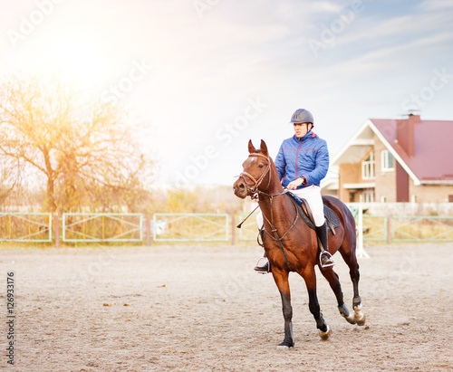 Sportsman riding horse on equestrian competition. © skumer