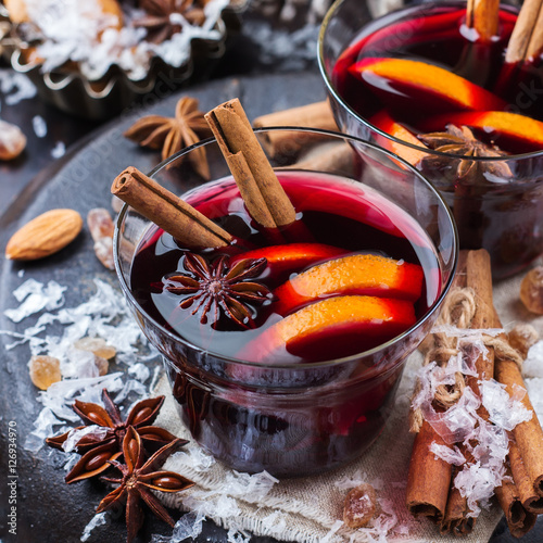 Hot mulled wine in a red mug for winter holidays
