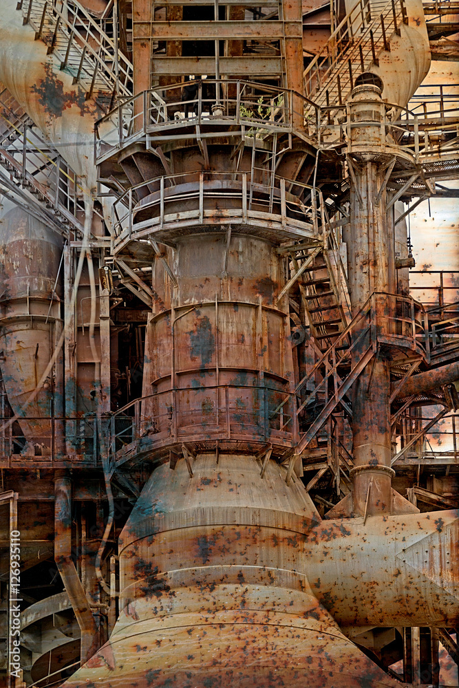 Rusty background with old steel furnace Rusty background with old steel furnace